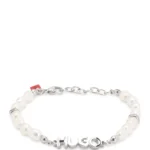 Pearl cuff with metal logo plaque