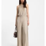 Halterneck jumpsuit in lustrous jersey with plissé pleats