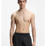 Swim shorts with all-over stacked logos