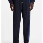 Relaxed-fit tracksuit bottoms in cotton with side stripe