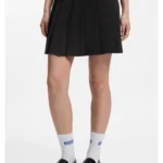 Pleated skirt in stretch cotton with integrated shorts