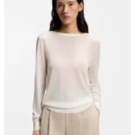 Knitted cardigan with rear button closure