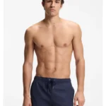 Swim shorts with all-over monogram print