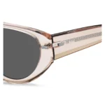 Translucent pink bio-acetate sunglasses with patterned rivets